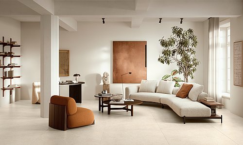 Wohnbereich mit Bodenfliesen, Sofa und Esstisch